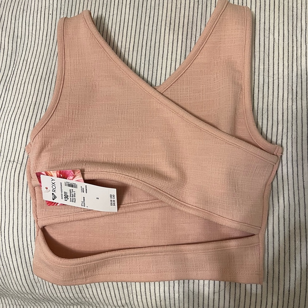 NWT. Roxy size small good keepsake wrap back tank. Never worn.